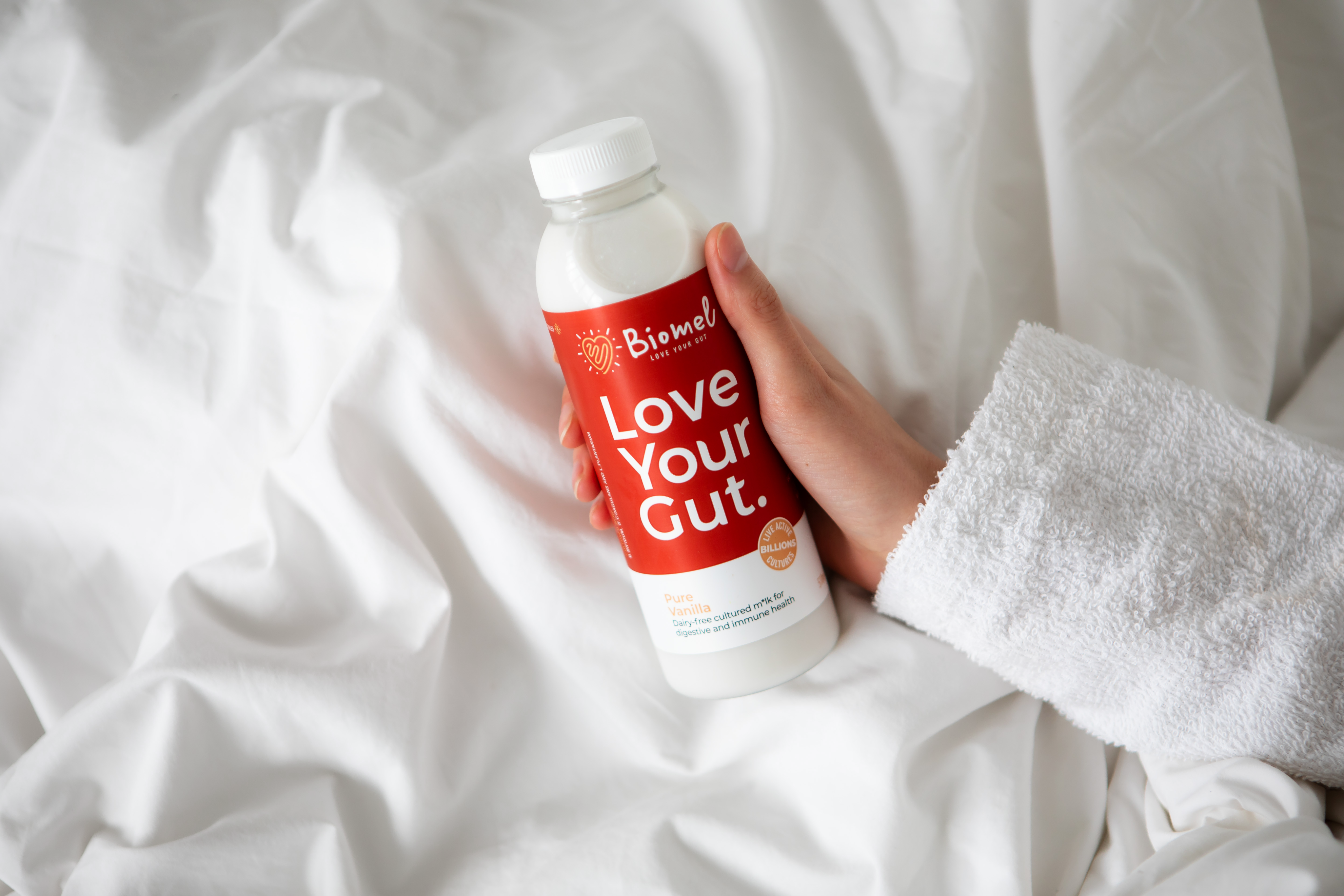 hand holding biomel pure vanilla