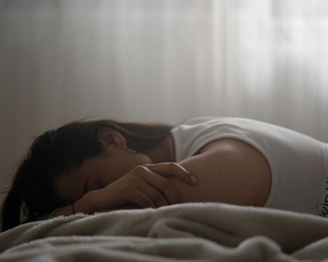 woman in bed resting 