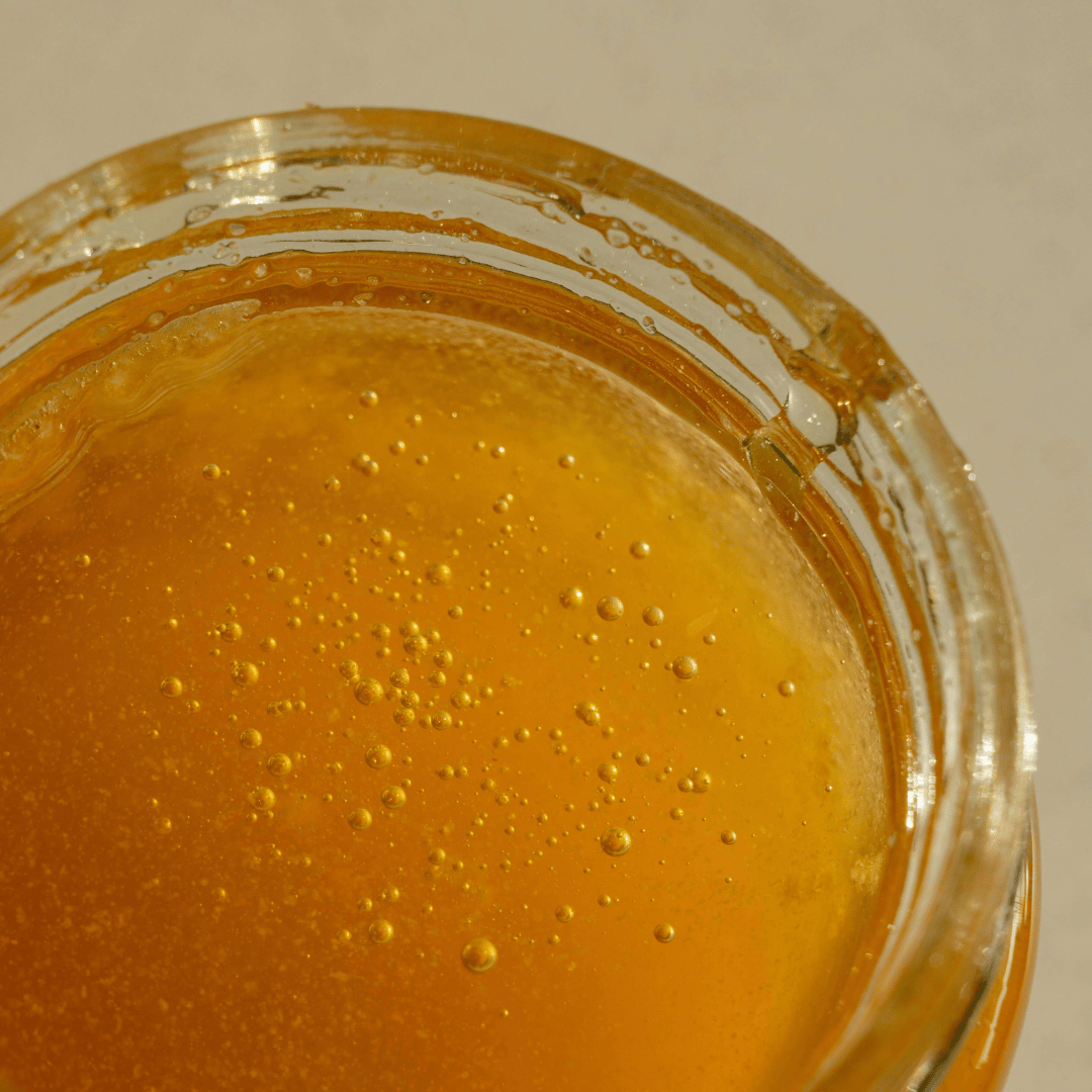 close up shot of a pot of honey 