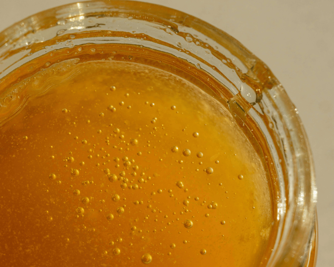close up shot of a pot of honey 