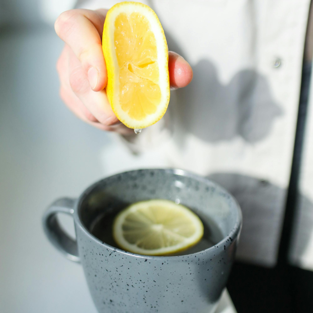woman making a lemon water