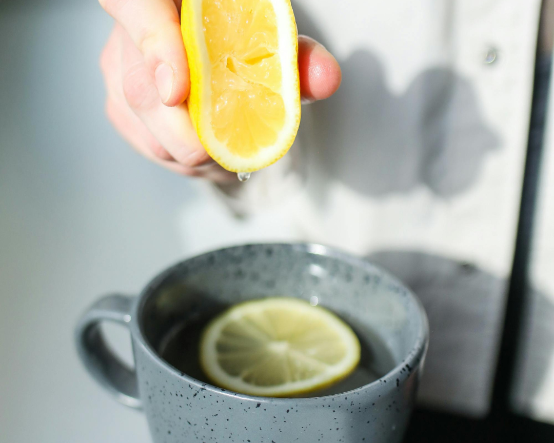 woman making a lemon water