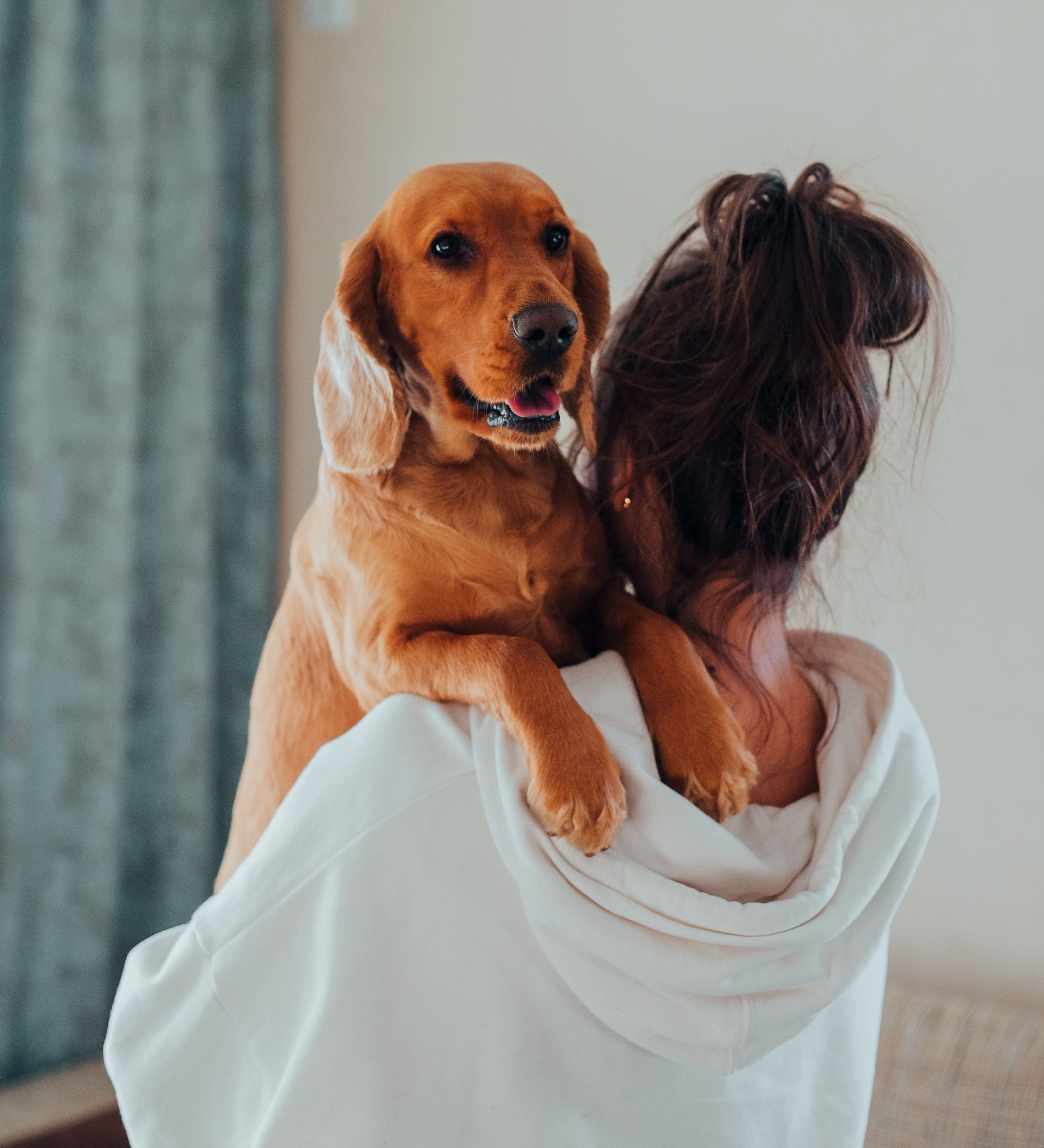 woman holding dog