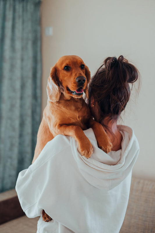 woman holding dog