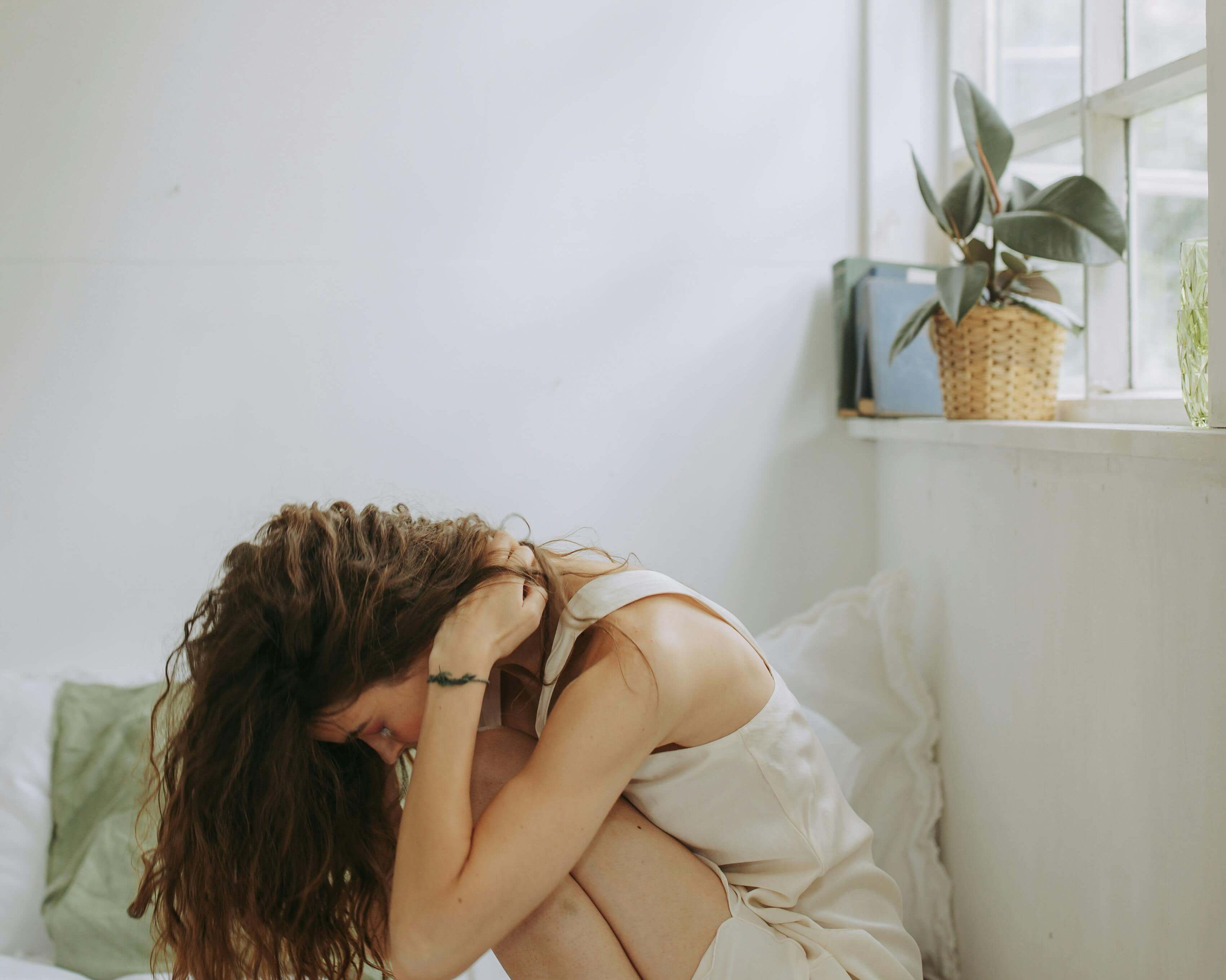 woman bent over in pain