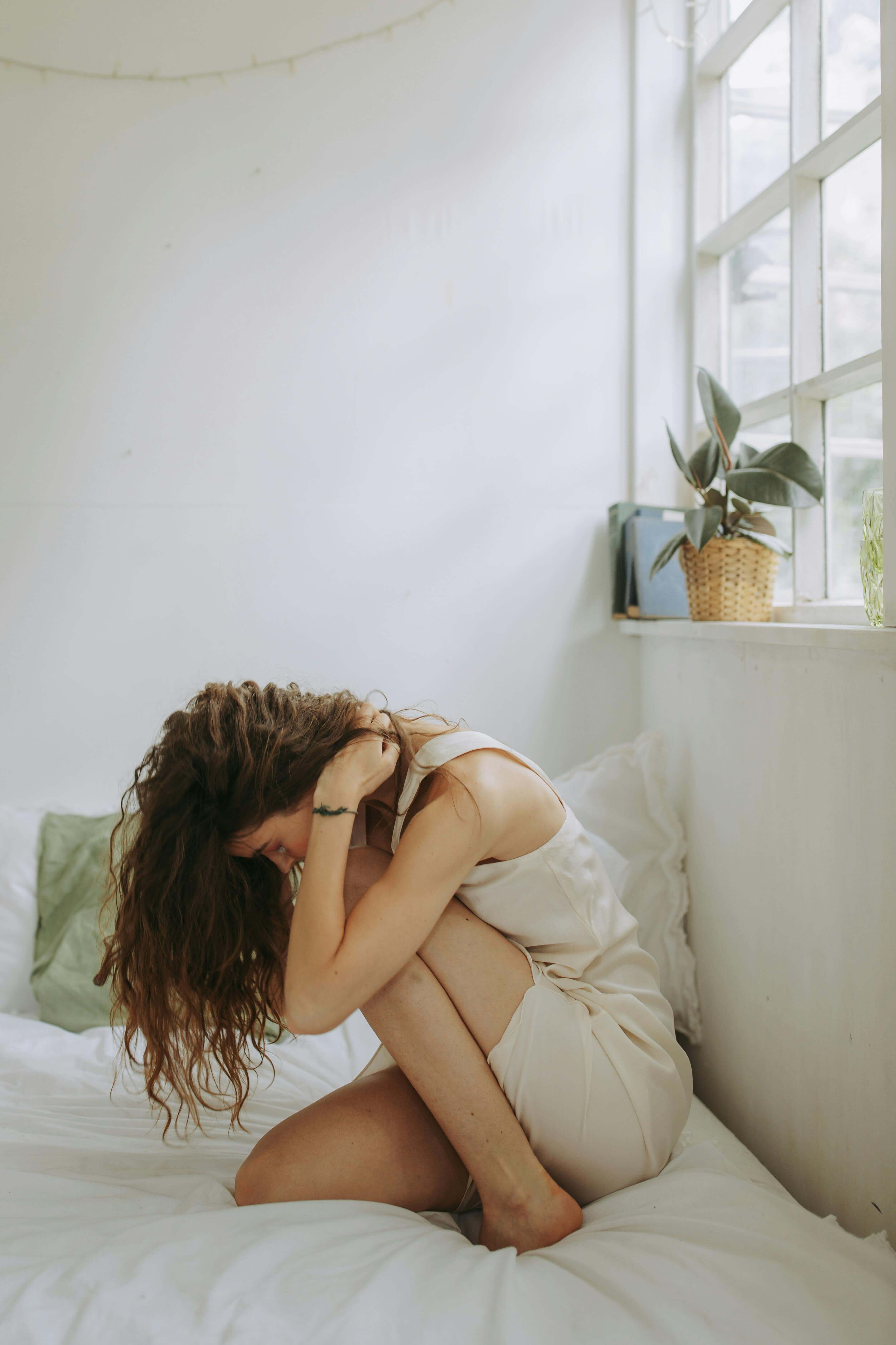 woman bent over in pain